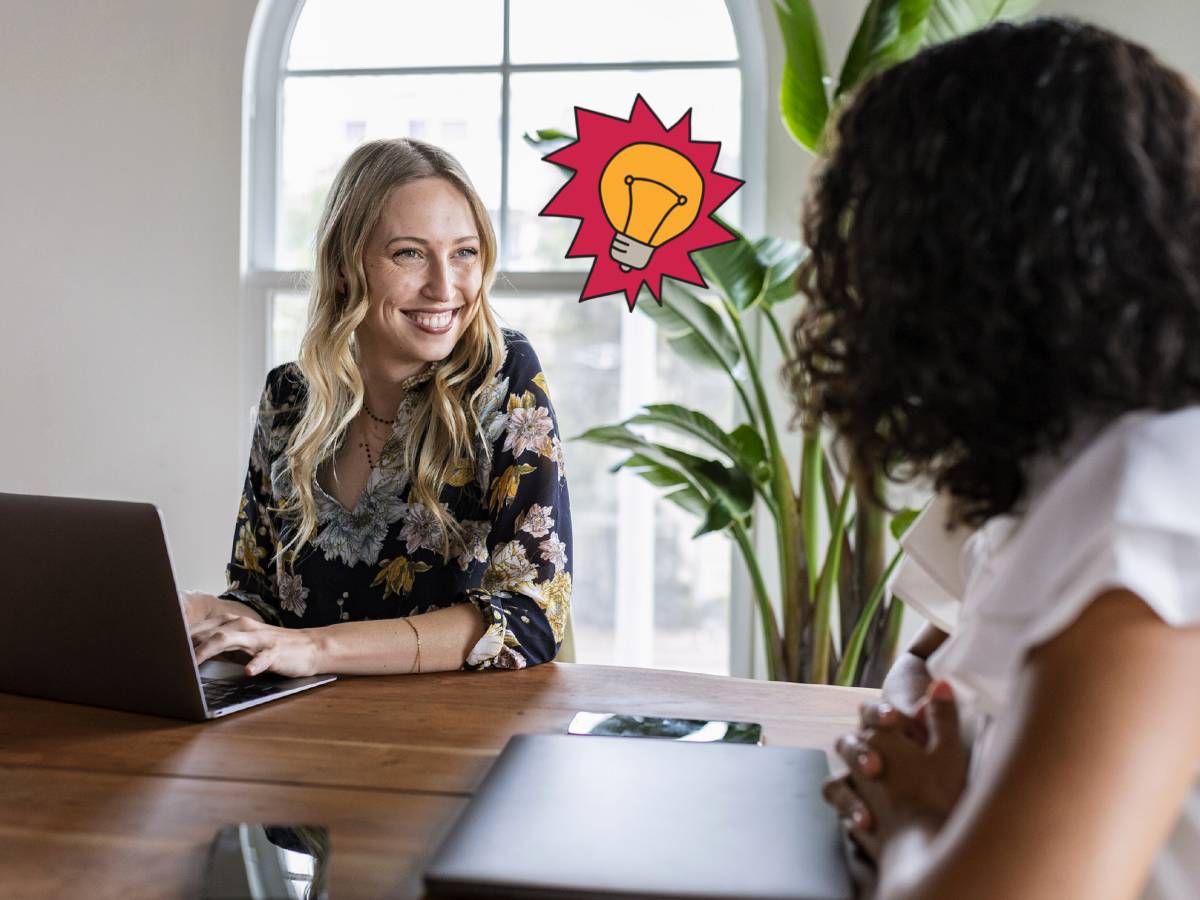 Finding ideal clients online 2022 two women with laptops at work with hand drawn light bulb element