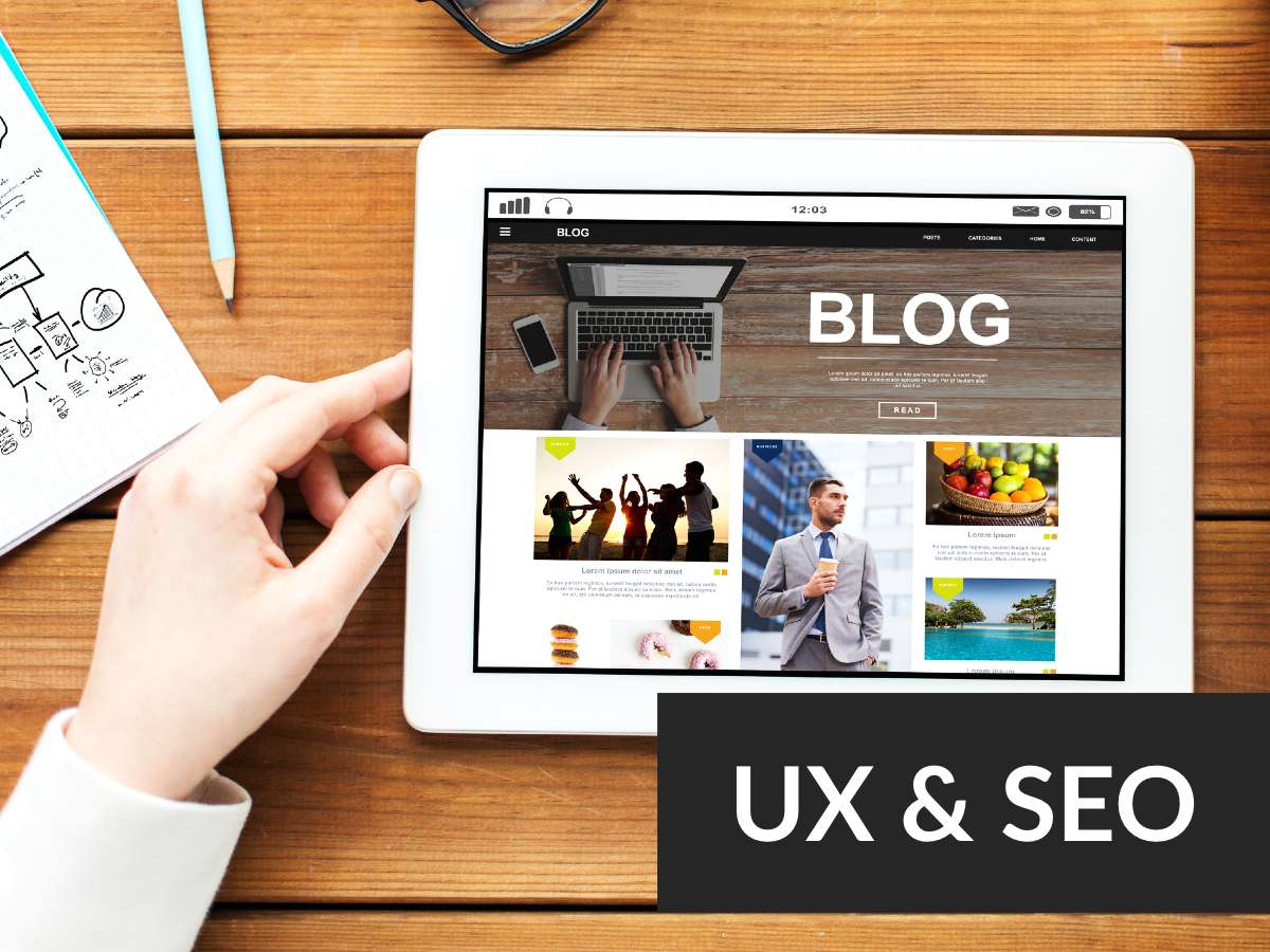 Main blog UX and SEO in white text with black background - ipad on table view down with main blog page visible